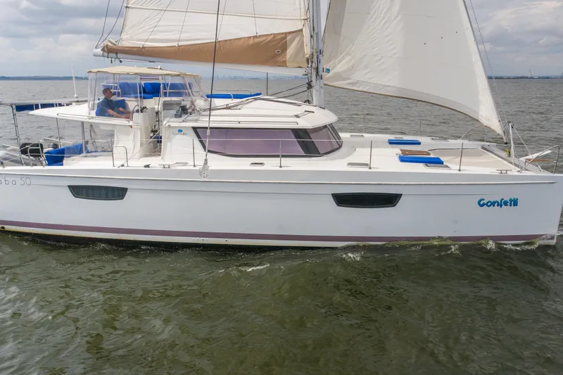 Confetti Yacht Photos Pics 2016 Fountaine Pajot SABA 50 catamaran sailing on open water.