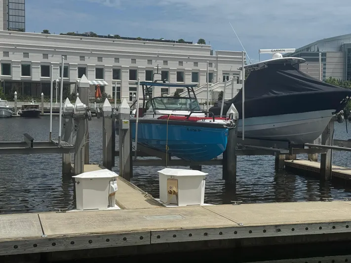  Yacht Photos Pics 2022 Axopar 28 T-top Aft Cabin Brabus Trim docked at marina.