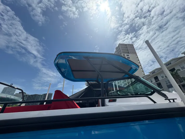  Yacht Photos Pics 2022 Axopar 28 T-top Aft Cabin Brabus Trim under a sunny sky.