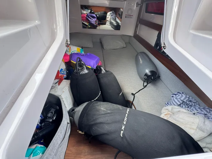  Yacht Photos Pics Interior of 2022 Axopar 28 T-top Aft Cabin with diving gear and supplies.