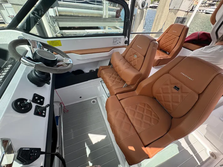  Yacht Photos Pics 2022 Axopar 28 T-top Aft Cabin Brabus Trim with luxurious tan leather seats.