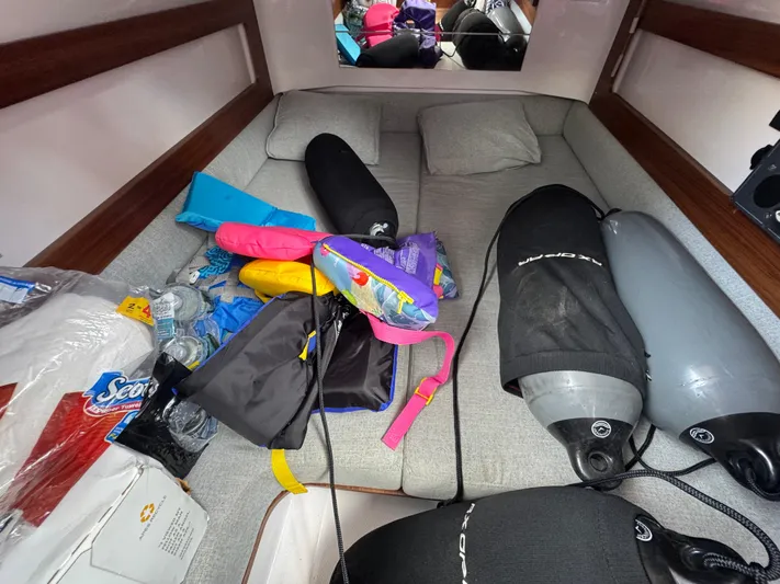  Yacht Photos Pics Interior of 2022 Axopar 28 T-top Aft Cabin with scuba gear and supplies.