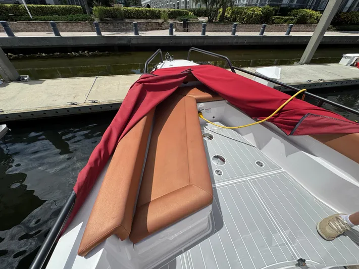  Yacht Photos Pics 2022 Axopar 28 T-top Aft Cabin with Brabus Trim, docked with red cover partially removed.