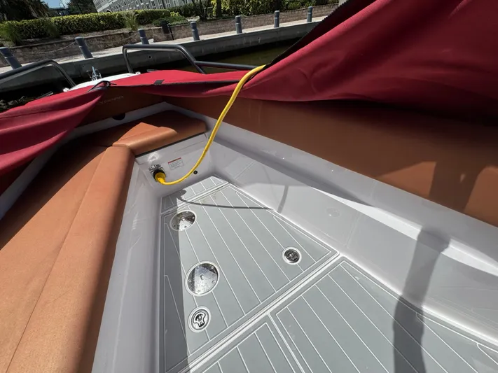  Yacht Photos Pics 2022 Axopar 28 T-top Aft Cabin Brabus Trim interior with red cover and tan seating.