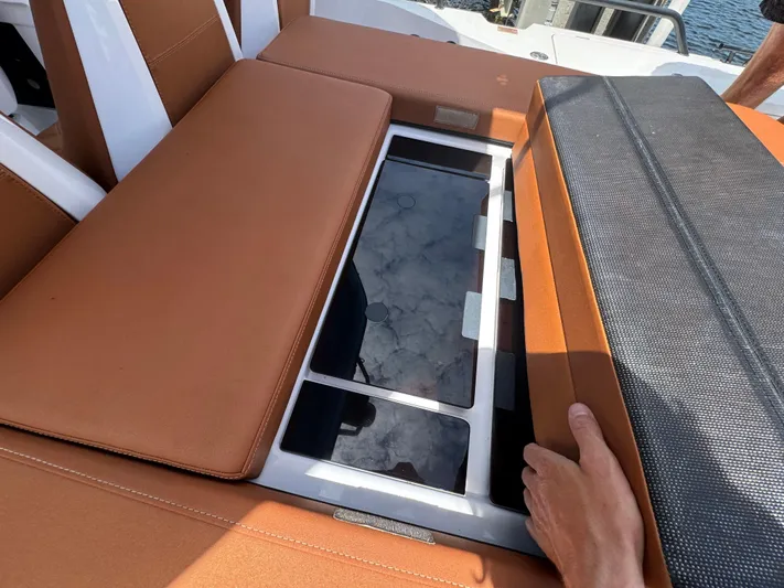  Yacht Photos Pics 2022 Axopar 28 T-top Aft Cabin Brabus Trim with open storage compartment.