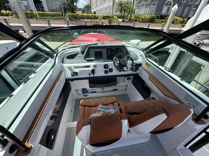  Yacht Photos Pics Interior view of 2022 Axopar 28 T-top Aft Cabin Brabus Trim boat cockpit.