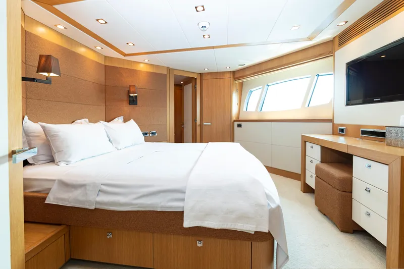  Yacht Photos Pics Luxurious bedroom interior on a 2011 Sunseeker 34 Metre Yacht, featuring modern design and elegant furnishings.