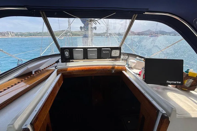 Prism Yacht Photos Pics Cockpit view of 1984 Oyster 435 sailboat with Raymarine navigation equipment.