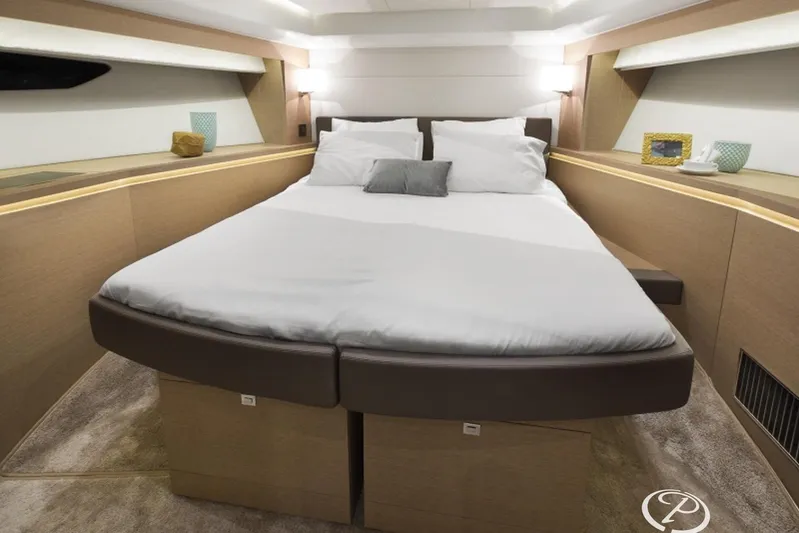  Yacht Photos Pics Luxurious bedroom interior of 2016 Prestige 550 yacht with modern design and cozy bedding.