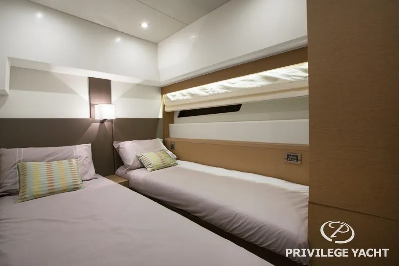  Yacht Photos Pics Luxurious twin cabin interior of 2016 Prestige 550 yacht with modern decor.