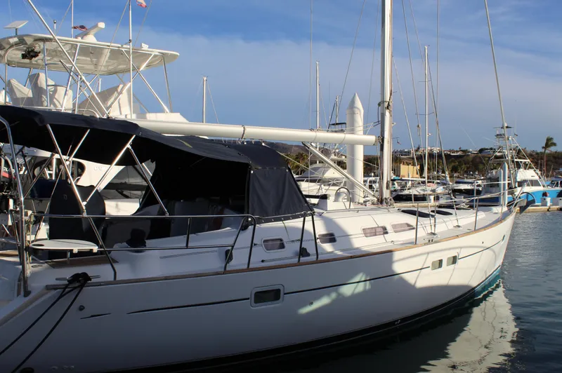 Coyote Yacht Photos Pics 2004 Beneteau Oceanis Clipper 423 sailboat docked in marina, featuring sleek design and spacious deck.