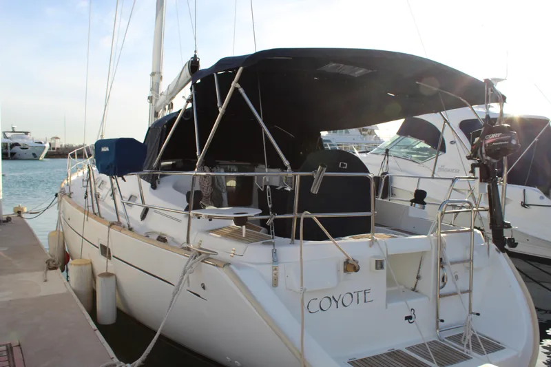 Coyote Yacht Photos Pics 2004 Beneteau Oceanis Clipper 423 sailboat docked at marina, rear view.