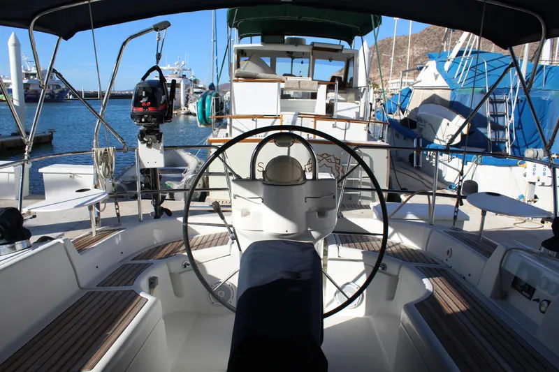 Coyote Yacht Photos Pics 2004 Beneteau Oceanis Clipper 423 yacht cockpit with steering wheel, docked in marina.