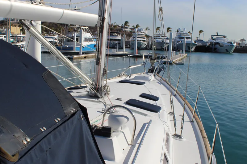 Coyote Yacht Photos Pics 2004 Beneteau Oceanis Clipper 423 sailboat docked in a marina, surrounded by other boats.