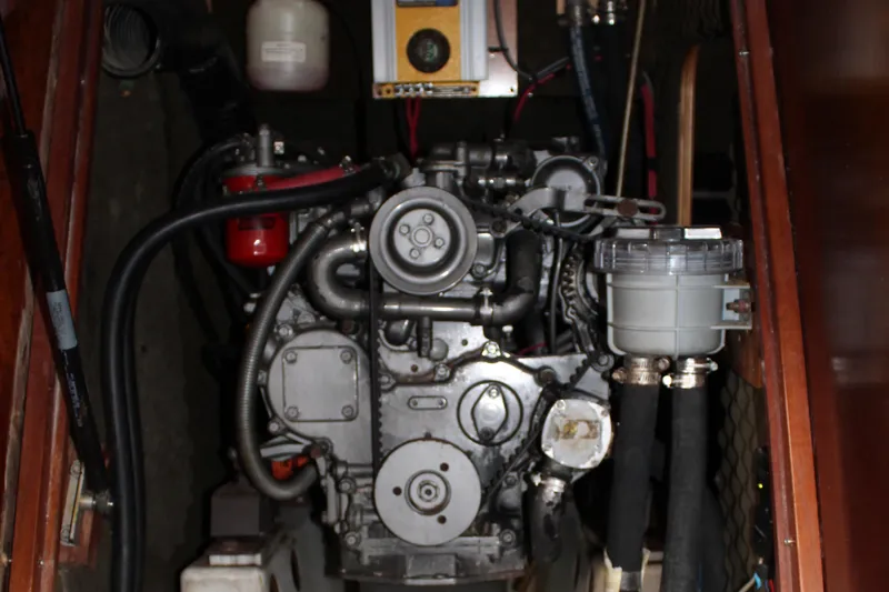 Coyote Yacht Photos Pics Engine compartment of a 2004 Beneteau Oceanis Clipper 423 sailboat, showcasing mechanical components.