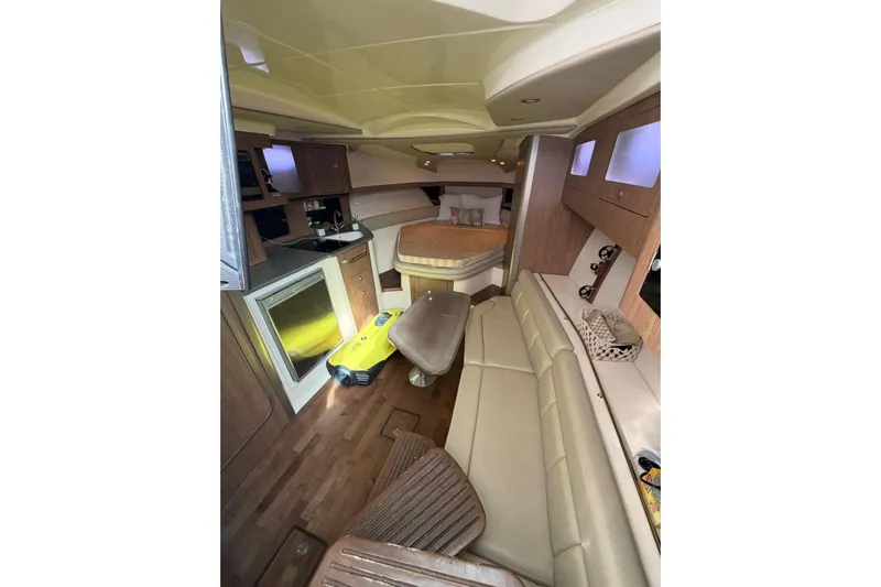  Yacht Photos Pics Interior of 2012 Boston Whaler 345 Conquest, featuring cozy seating and modern amenities.