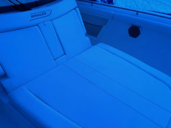  Yacht Photos Pics 2016 Boston Whaler 350 Outrage interior seating, featuring sleek white upholstery.