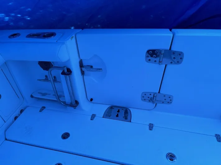  Yacht Photos Pics 2016 Boston Whaler 350 Outrage boat interior with storage compartments and hinges.