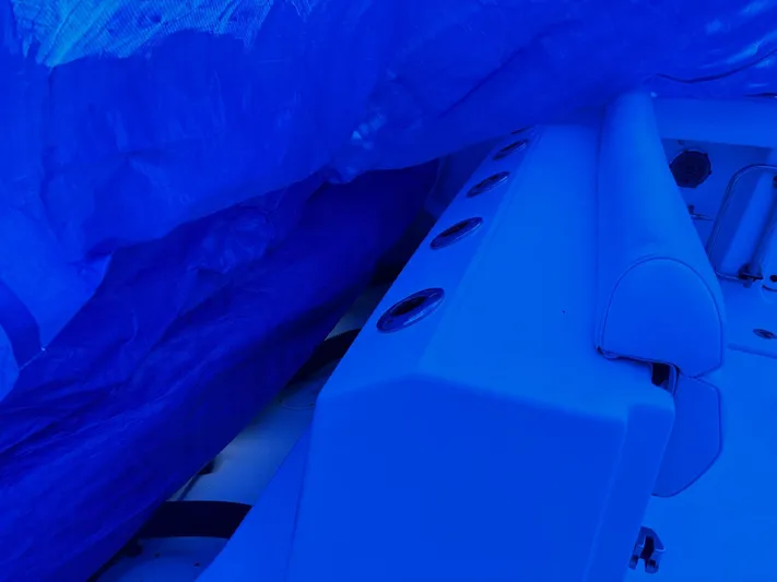  Yacht Photos Pics 2016 Boston Whaler 350 Outrage partially covered with blue tarp.
