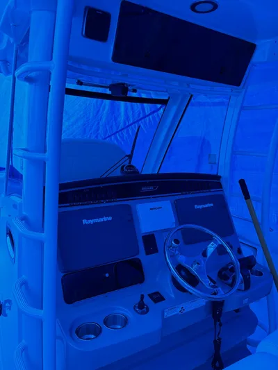  Yacht Photos Pics 2016 Boston Whaler 350 Outrage helm with steering wheel and navigation screens.