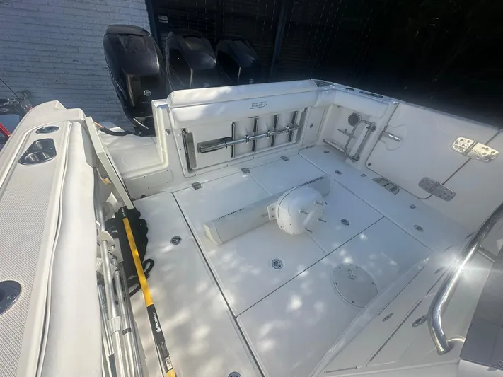  Yacht Photos Pics 2016 Boston Whaler 350 Outrage boat deck with storage and rod holders.