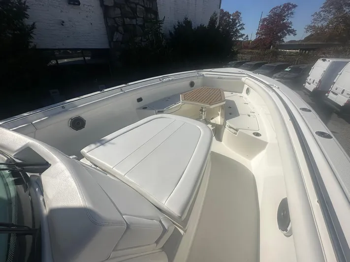  Yacht Photos Pics 2016 Boston Whaler 350 Outrage boat interior with white seating and deck.