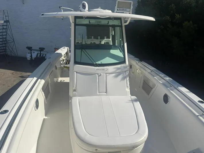  Yacht Photos Pics 2016 Boston Whaler 350 Outrage boat with white seating and center console.
