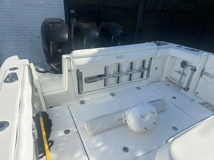  Yacht Photos Pics 2016 Boston Whaler 350 Outrage boat deck with rod holders and engines.