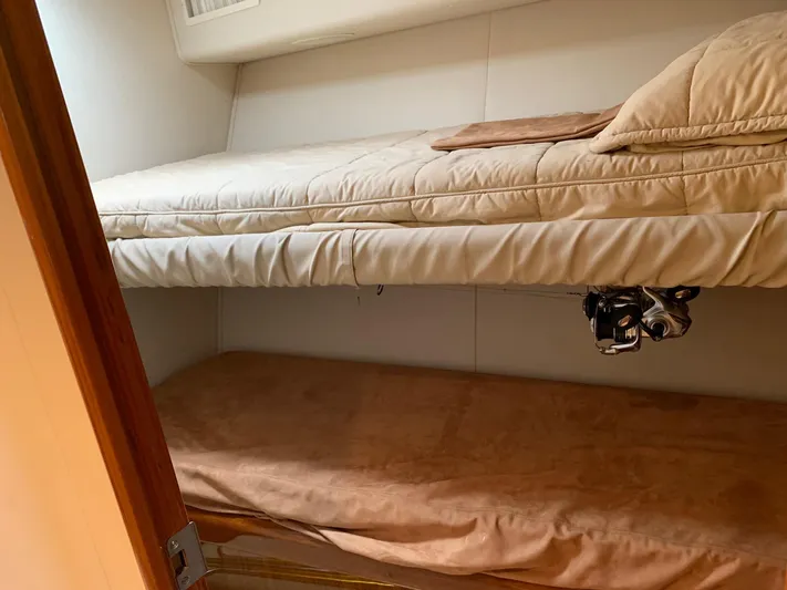  Yacht Photos Pics Bunk beds in a 2007 Viking 52 yacht cabin, featuring cozy bedding.