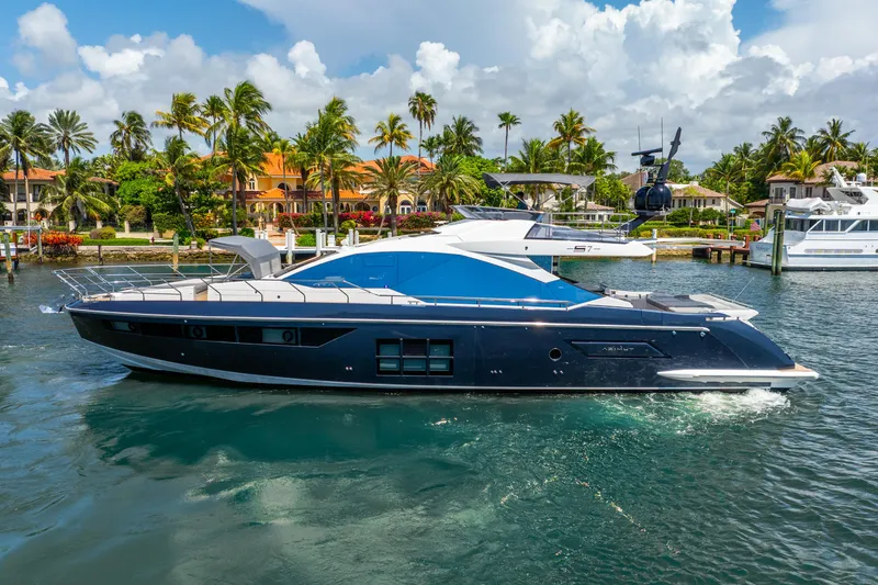  Yacht Photos Pics 2019 Azimut S7 yacht cruising near tropical waterfront homes.