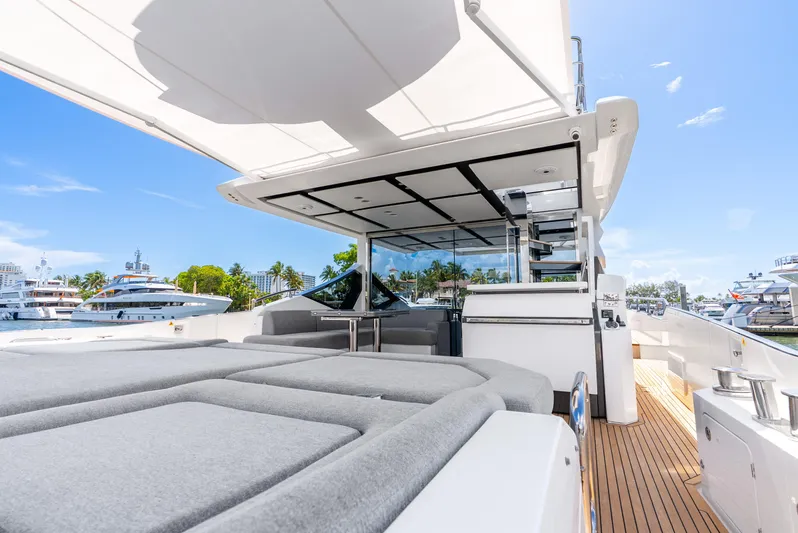  Yacht Photos Pics Luxurious 2019 Azimut S7 yacht deck with sunbeds and canopy, docked at marina.