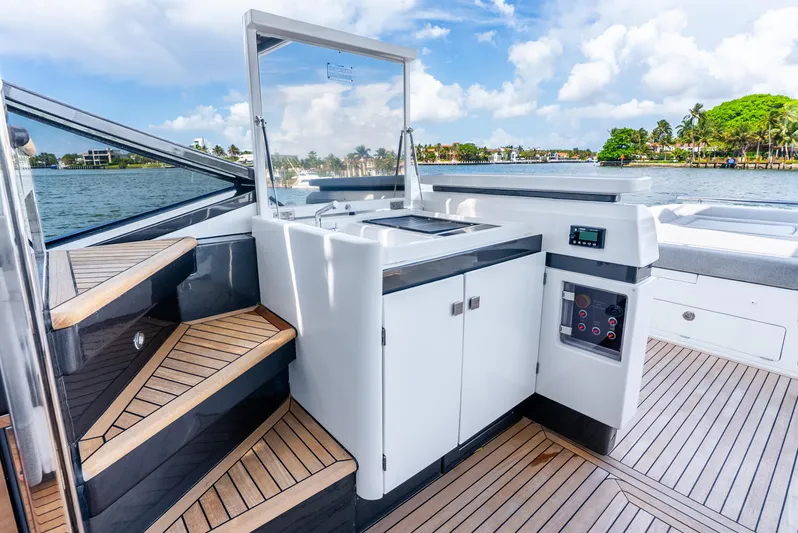  Yacht Photos Pics 2019 Azimut S7 yacht deck with modern design and wooden flooring, overlooking scenic water view.