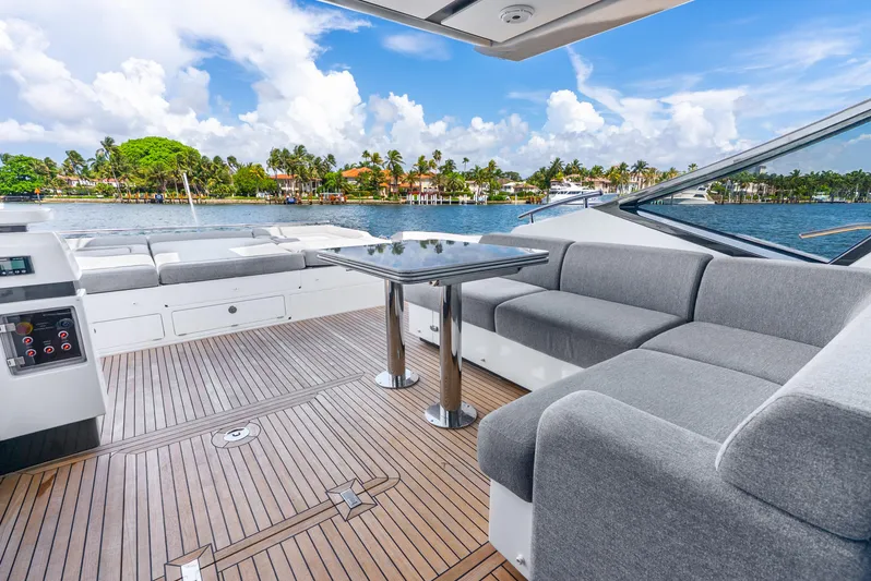  Yacht Photos Pics Luxurious 2019 Azimut S7 yacht deck with elegant seating and scenic waterfront view.