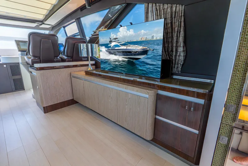  Yacht Photos Pics Luxurious interior of a 2019 Azimut S7 yacht with modern furnishings and a flat-screen TV.