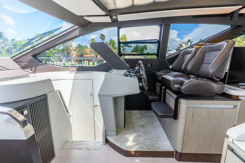  Yacht Photos Pics Luxurious interior of 2019 Azimut S7 yacht with modern helm and leather seating.