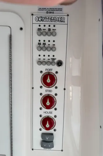 Used Yacht Photos Pics Control panel of 2024 Contender 28 Tournament boat with labeled switches and dials.