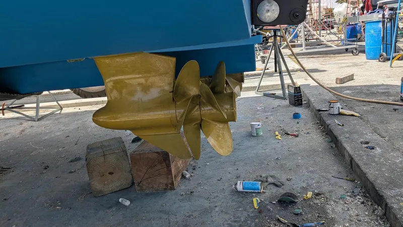 Ain't Settlin! Yacht Photos Pics Propeller of 2013 Prestige 550 Flybridge yacht in maintenance area.