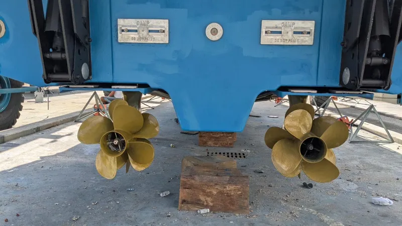 Ain't Settlin! Yacht Photos Pics Propellers of a 2013 Prestige 550 Flybridge yacht on dry dock.