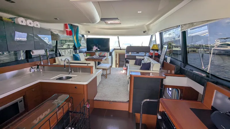 Ain't Settlin! Yacht Photos Pics Luxurious interior of a 2013 Prestige 550 Flybridge yacht with modern amenities and spacious design.