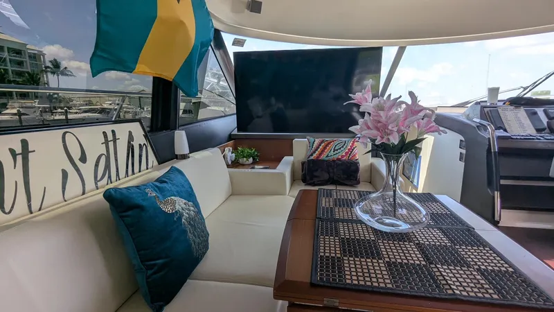 Ain't Settlin! Yacht Photos Pics Luxurious interior of 2013 Prestige 550 Flybridge yacht with elegant seating and decor.