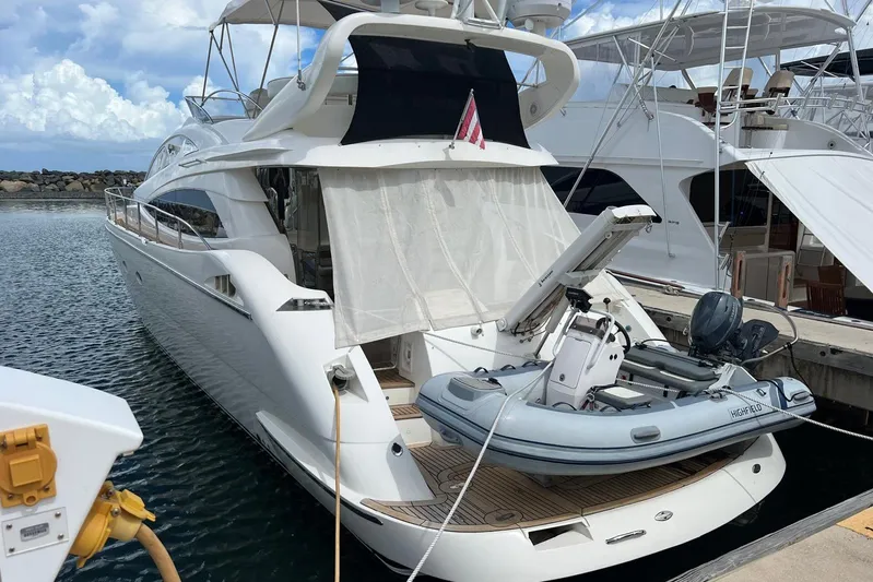  Yacht Photos Pics Luxury 2007 Aicon 56 yacht docked with inflatable boat on deck.