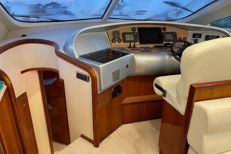  Yacht Photos Pics Luxury yacht helm of 2007 Aicon 56 with modern controls and plush seating.