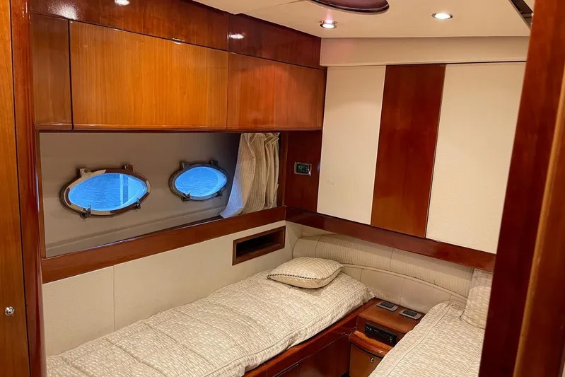  Yacht Photos Pics Luxurious 2007 Aicon 56 yacht cabin with twin beds and elegant wood paneling.