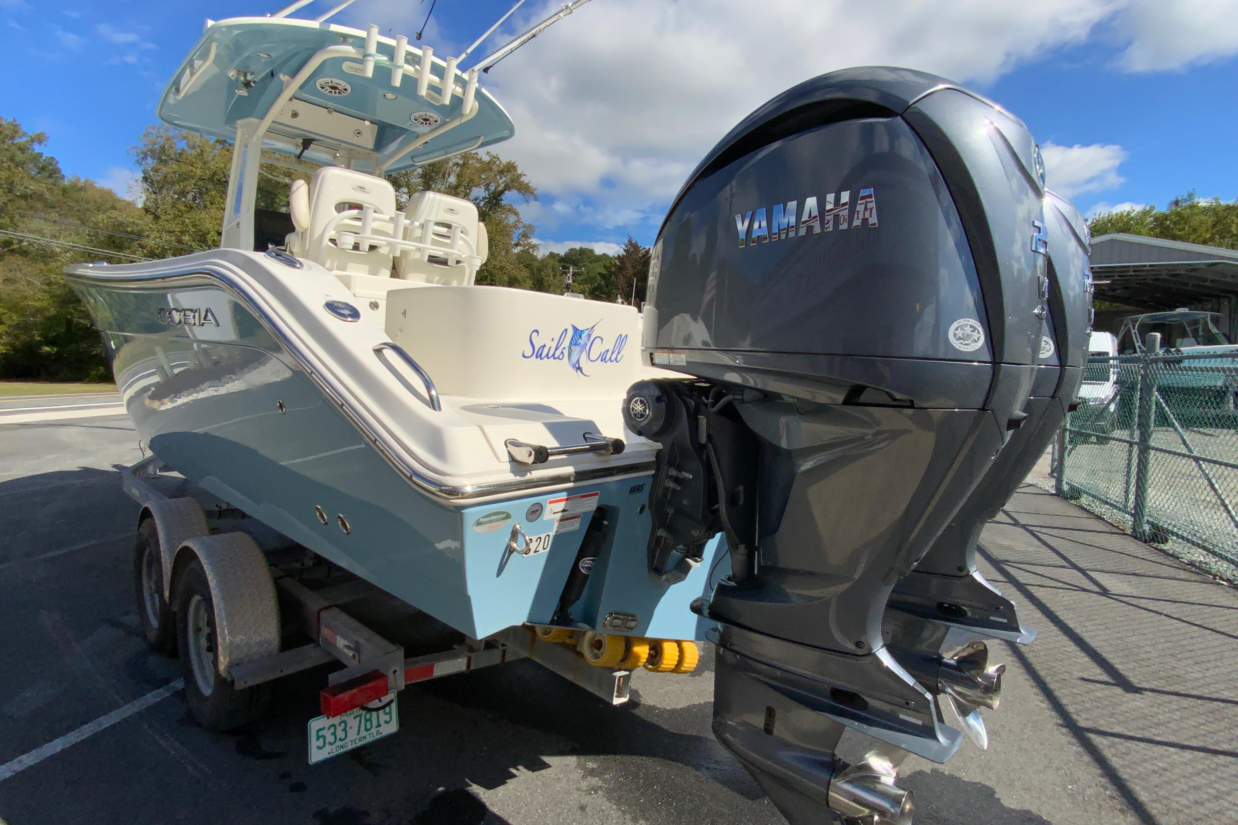 2021 Cobia 280 Center Console boat with Yamaha engines on a trailer.