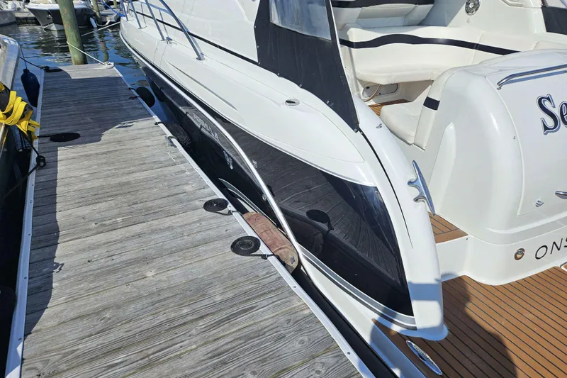 Sea Wolf Yacht Photos Pics 2010 Formula 34 Performance Cruiser docked at marina, showcasing sleek design and luxury features.