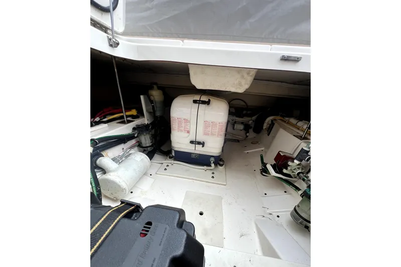  Yacht Photos Pics 2019 Tiara Sport 34 LS boat engine compartment with equipment and wiring.