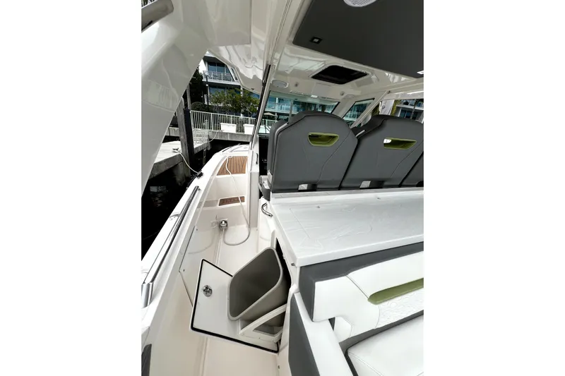  Yacht Photos Pics 2019 Tiara Sport 34 LS boat interior with seating and storage compartments.