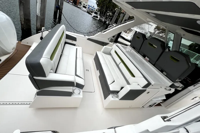  Yacht Photos Pics 2019 Tiara Sport 34 LS boat interior with luxurious seating and waterfront view.
