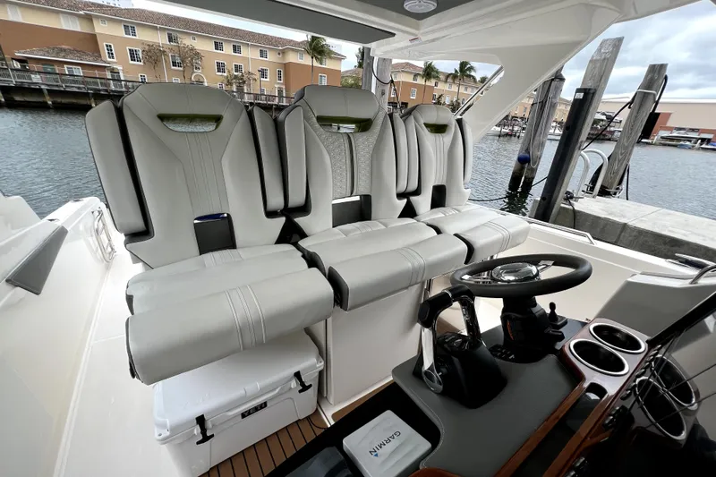  Yacht Photos Pics 2019 Tiara Sport 34 LS boat interior with luxurious seating and modern helm controls.