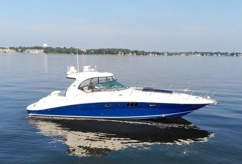 Debra Lee Yacht Photos Pics 2006 Sea Ray 44 Sundancer yacht cruising on calm waters.